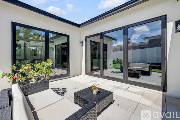 A patio with a table and chairs is shown.