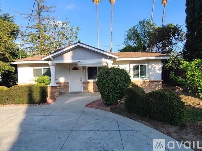 A house with a white front door and a driveway.