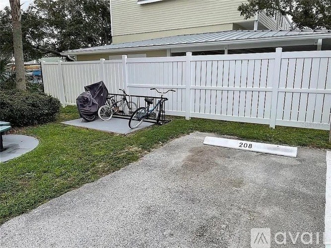 A white fence with a number 208 on it.