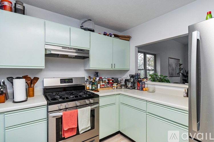 A window with a view of a lake and trees.