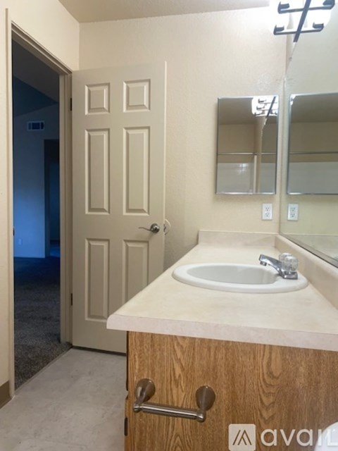 A graphic with a wheelchair and a house symbolizing equal housing opportunity.