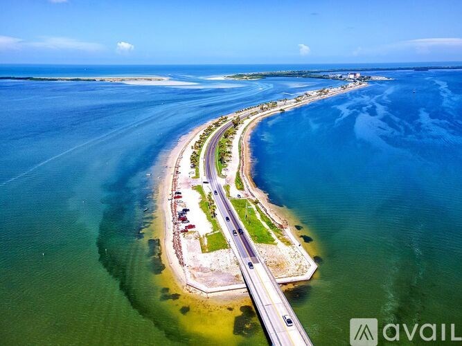 A long bridge stretches across a body of water.