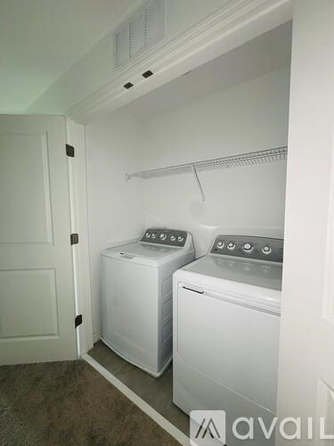 A laundry room with a washer and dryer.