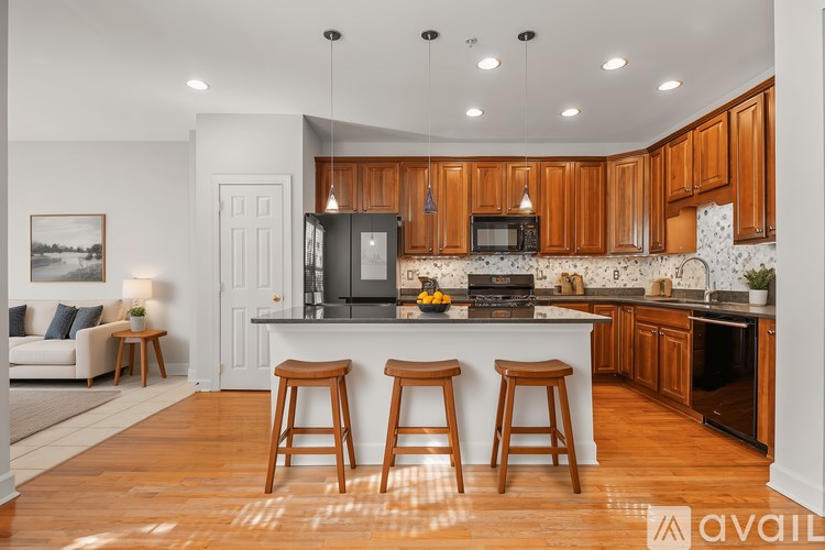 A kitchen with wooden cabinets and a white countertop.