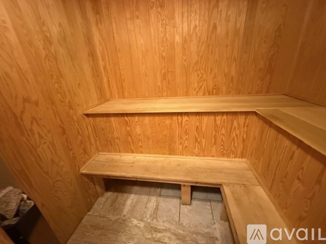 A wooden shelf in a room under construction.