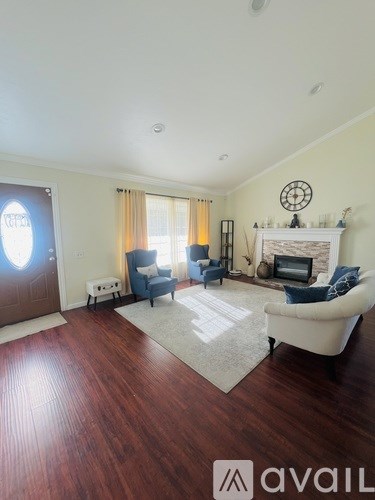 A living room with a fireplace and a couch.
