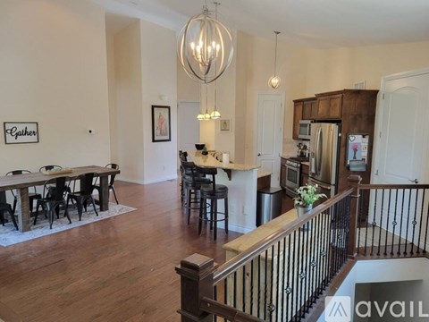 A large open living space with a dining table and chairs.