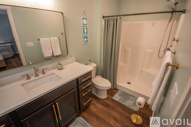 A bathroom with a sink, toilet, and bathtub.