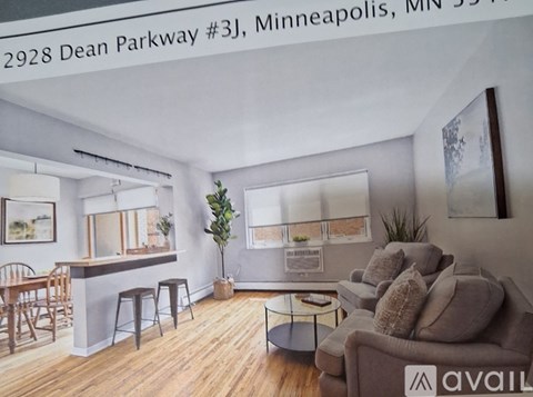 A living room with a couch, chairs, and a bar area.