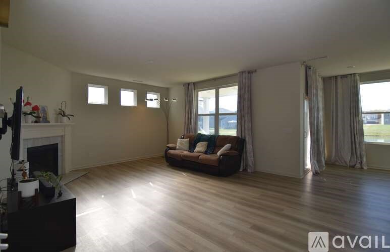 A living room with a fireplace and a couch.