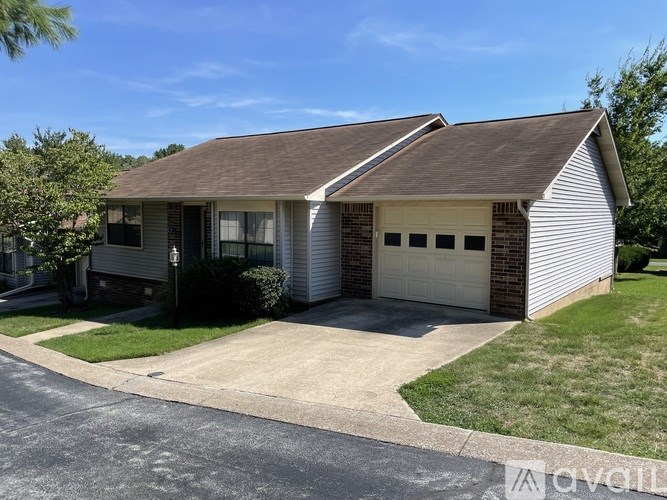 A two-car garage is attached to a house.