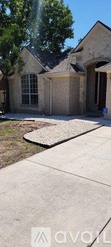 A house with a driveway in front of it.