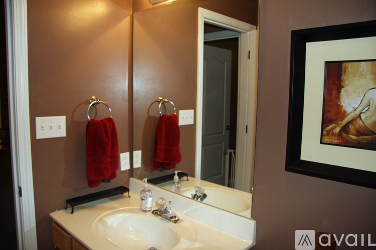 A bathroom with a double sink and a mirror.