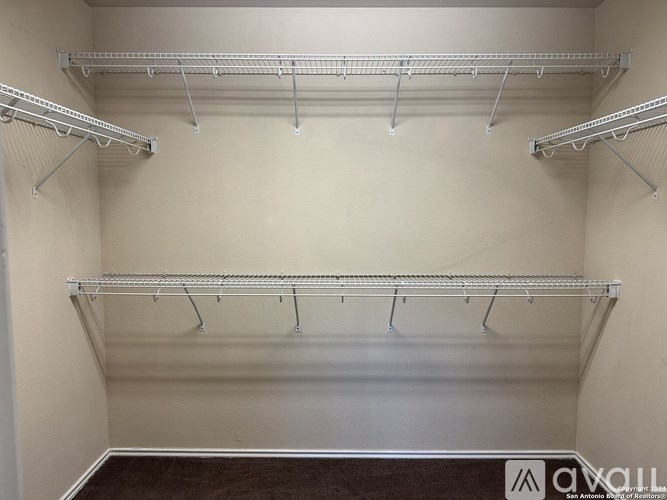 Empty shelves in a white room.