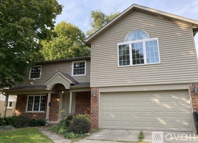 A house with a garage and a window.
