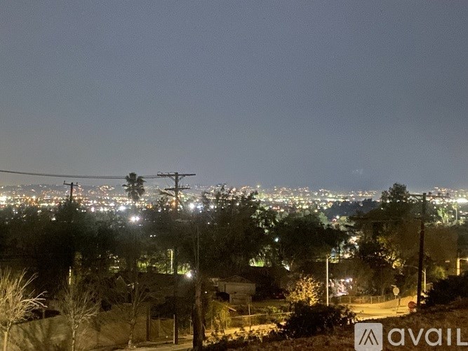 A cityscape at night with a view of the skyline.