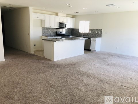 A kitchen with a counter and a sink.