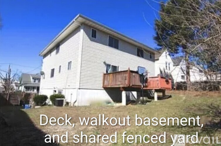 A house with a deck and a walkout basement.