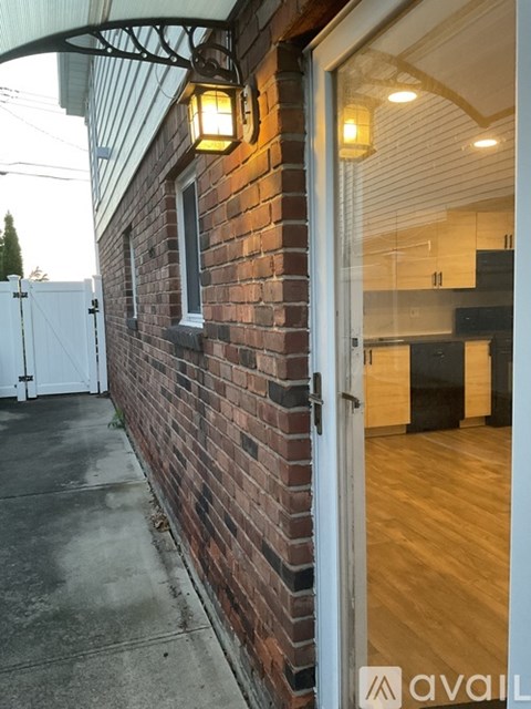 A brick wall with Avail logo on it.