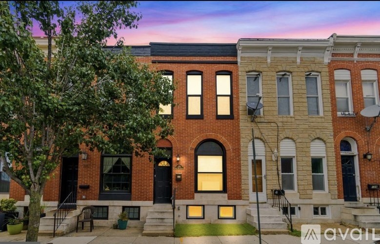 A building with a tree in front of it.