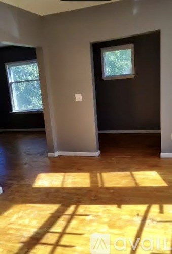 A room with a window and a door is on the market.