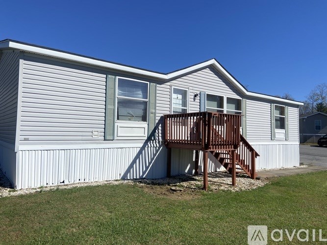 A house with a porch and a small front yard.