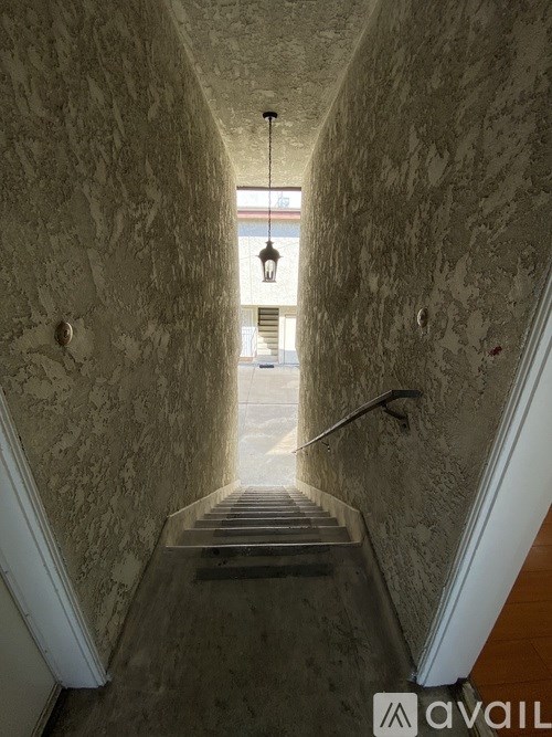 A long hallway with a light at the end.