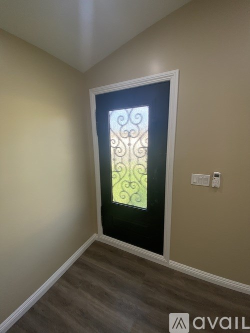 A room with a door and a window.