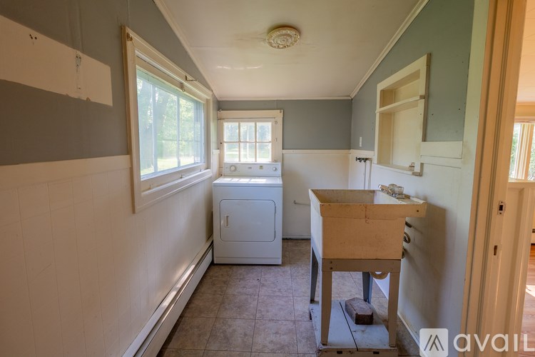 A laundry room with a washer and dryer.