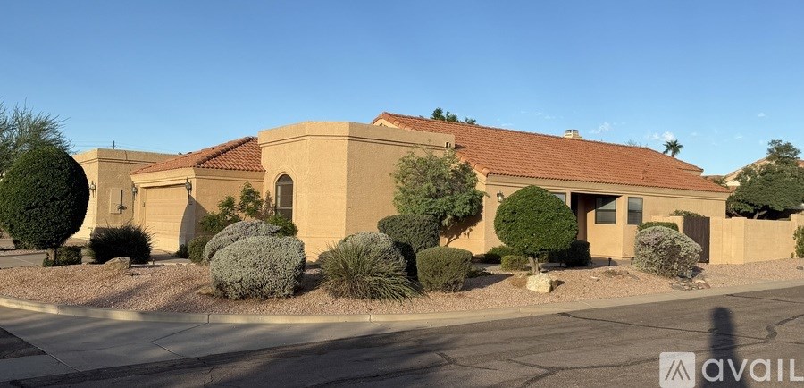 A house with a red roof and a sign that says "available" in front of it.
