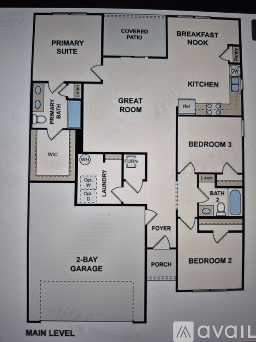 A floor plan of an apartment with a primary suite, two bedrooms, a garage, and a breakfast nook.