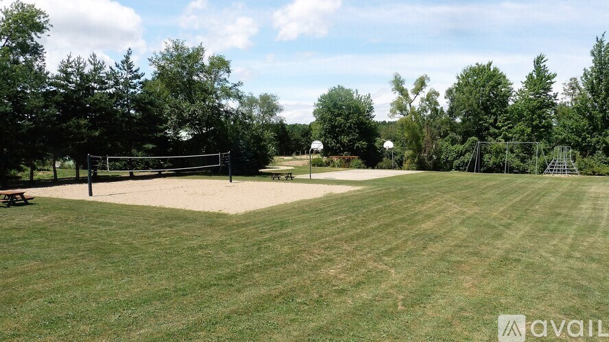 A soccer field with a goal post in the middle of it.