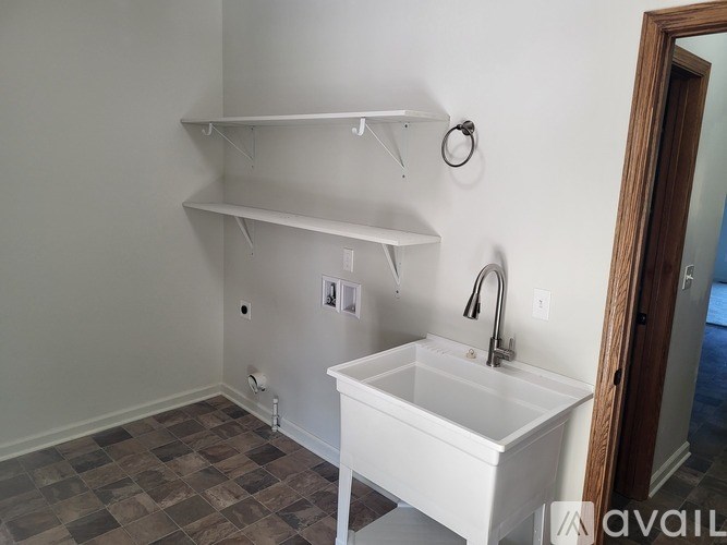 A bathroom with a sink and a mirror.