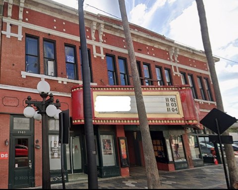 A red and white building with a sign that reads 11 02 and 11 04.