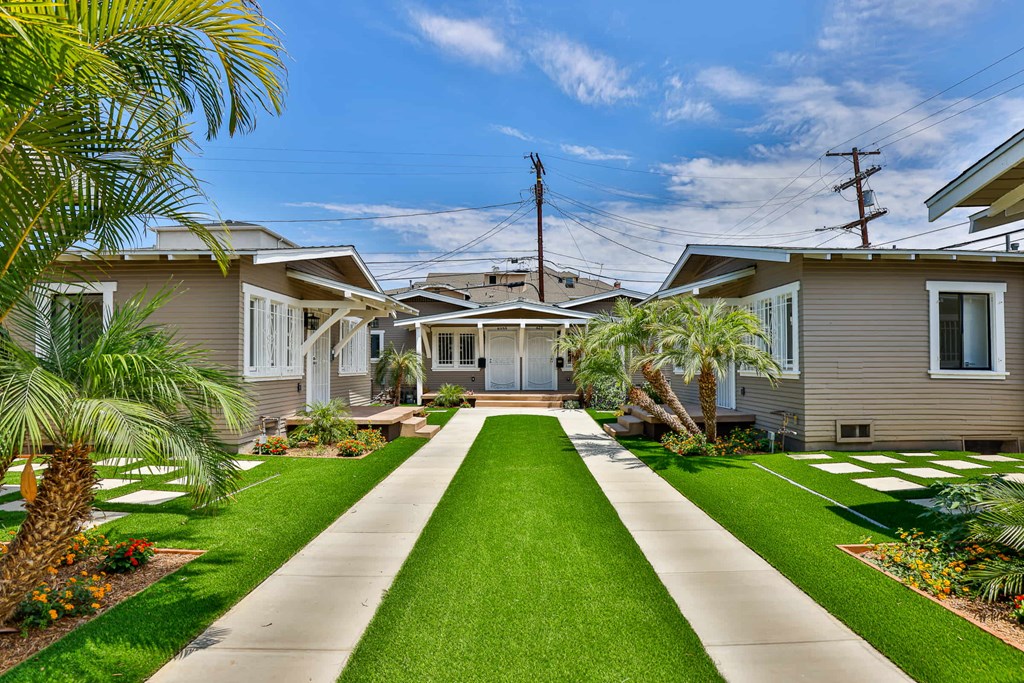 A residential area with houses and a clear sky.