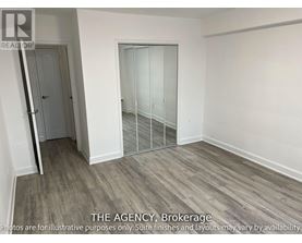 A room with a door and a glass partition wall.