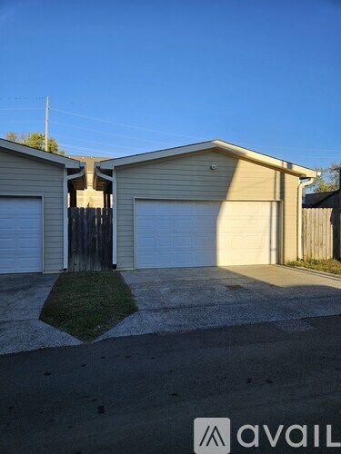 A house with a garage is for sale.