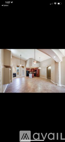 A room with a large open space and a long table in the middle.
