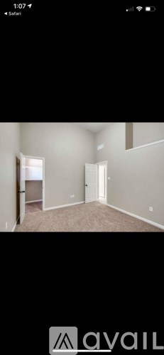 A room with a door and a window.