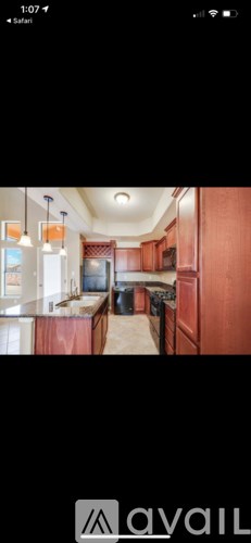 A kitchen with wooden cabinets and a countertop.