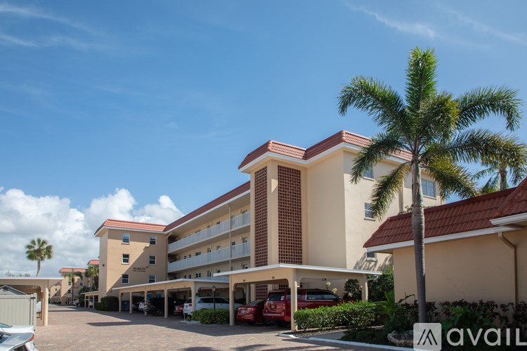 A building with a parking lot in front of it.