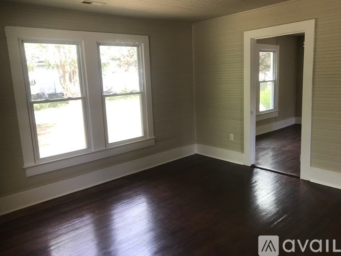 A room with a window and a door.