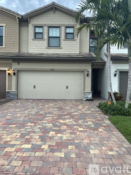 A house with a driveway in front of it.