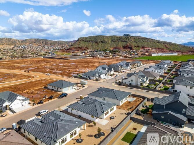 A suburban neighborhood with houses and a construction site in the foreground.