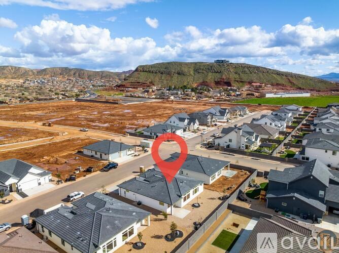 A bird's eye view of a residential area with a red heart symbol indicating a specific location.