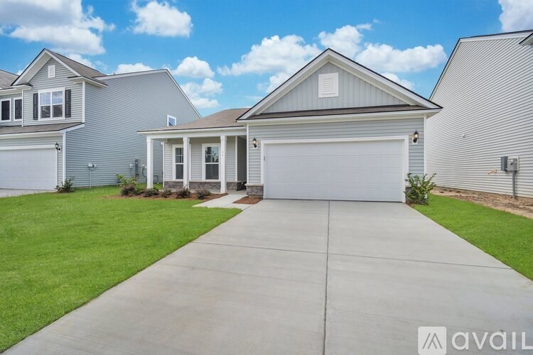 A house with a garage is available for sale.