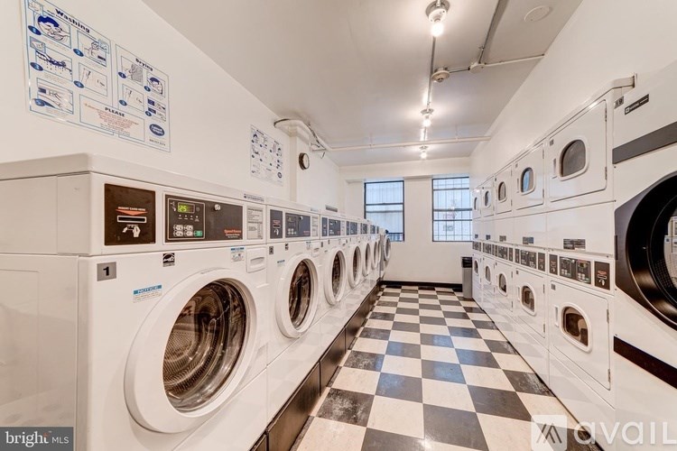 A row of washing machines in a laundromat.