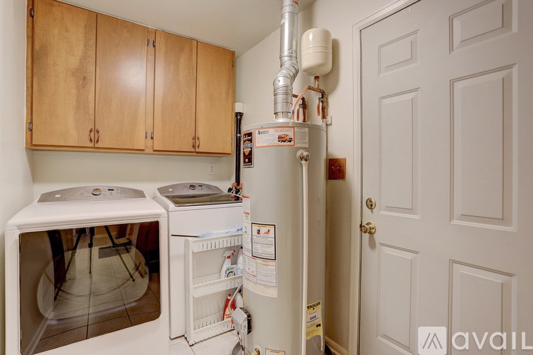 A small kitchen with a white fridge and a white dishwasher.