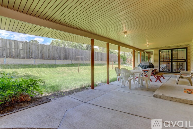 A patio with a table and chairs is available for rent.