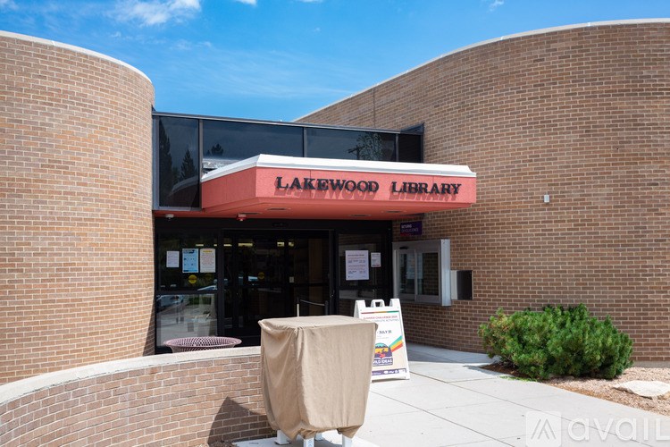 A brick building with a sign that says Lakewood Library.